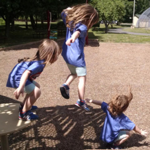 kids jumping on playground